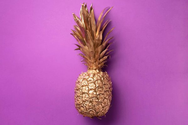 creative-layout-gold-pineapple-on-violet-backgroun-NJ6LXD5-scaled.jpg